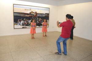 Art-goers enjoy the opening of an exhibition by artist Rafiqun Nabi at the Dhaka Art Center in Bangladesh's capital